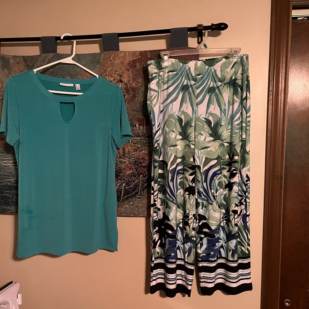 Two piece liquid knit tunic with cropped pants.  Brand new without tags.